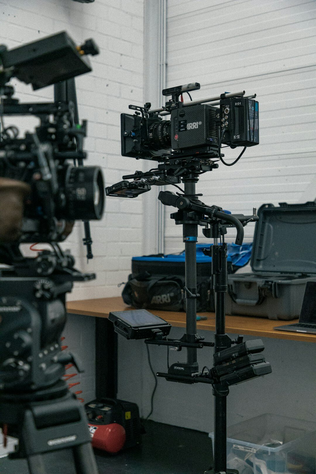 Live television studio with multiple cameras filming a set