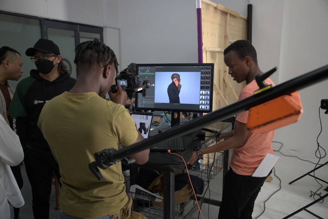 Diverse production team reviewing footage on monitors together
